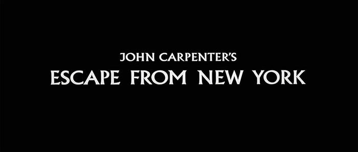 The ‘J’ in JOHN is a titling form, which is now an alternate but originally the only form in the first release of Albertus (1936). Two years later, the lowercase was added as well as ‘J’ and ‘Q’ with descender, which have become the default.