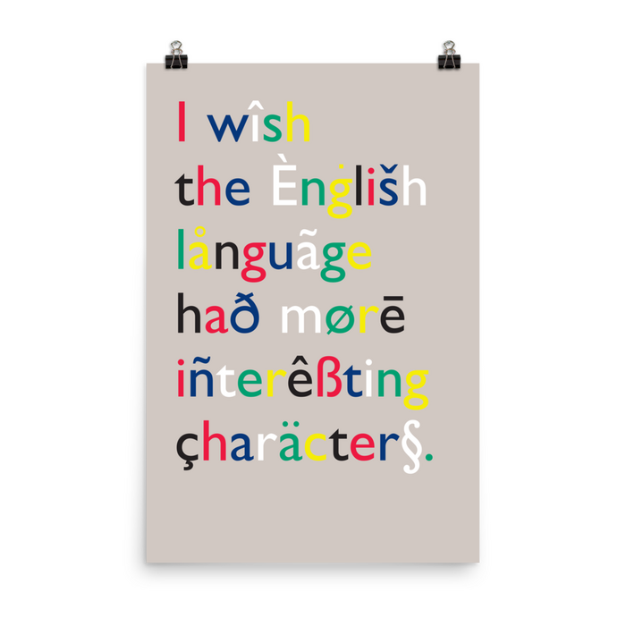 This reprise is different not only in the colors, but also in several of the characters and letterforms. The&nbsp;inclusion of a section sign (§)—which neither is an alphabetic character nor foreign to the English language—kind of dilutes the message.