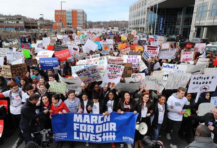 Demonstrators marched down Tremont Street, past Boston Police Headquarters, on their way to a rally on Boston Common.