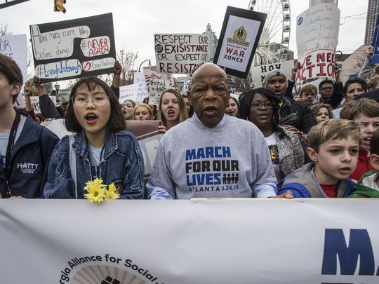 U.S. Rep. John Lewis leads a march of thousands through the streets of Atlanta on Saturday.