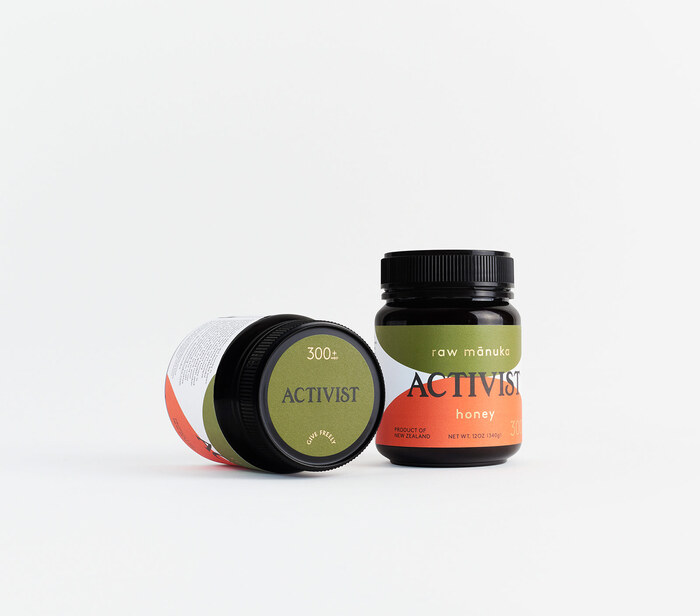 Gold foil elements appear on the body &amp; lid labels