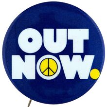 “OUT NOW” anti Vietnam war rally button