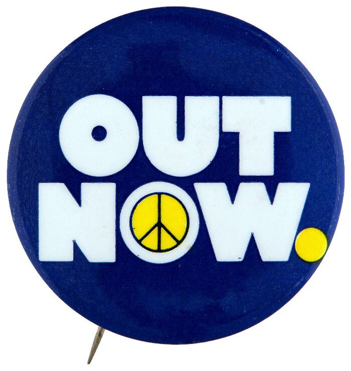 “OUT NOW” anti Vietnam war rally button