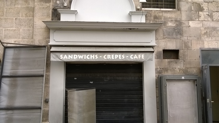 A sandwich café advertises in Lithos, a font that has come bundled with Adobe software for many years.