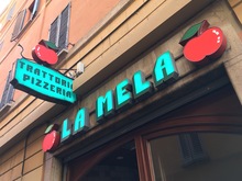 La Mela trattoria pizzeria signs