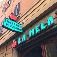 La Mela trattoria pizzeria signs