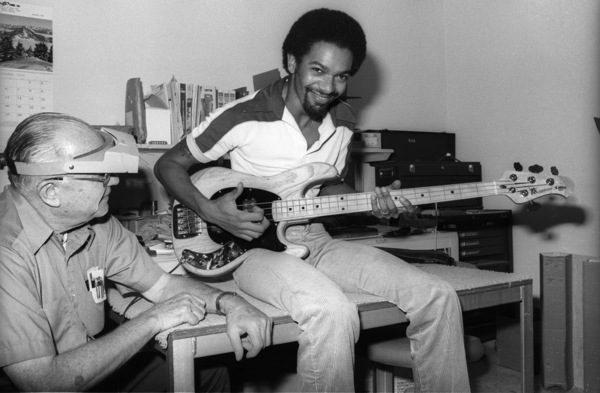 Brothers Johnson bassist Louis Johnson was a consultant to Leo Fender's CLF Research, from the beginning. His mastery of relatively new playing technique "slap" made him the player with perfect input.