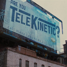 <cite>Looper</cite> billboard film prop