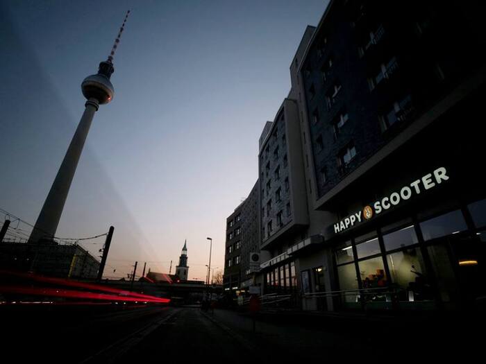 Illuminated sign at the flagship store at Alexanderplatz, Berlin.