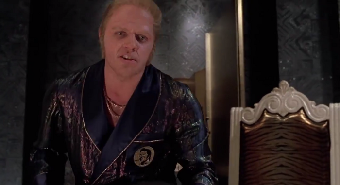 I was not able to find a more prominent instance of the specific logo, though the design with the circle with face on it was used on Biff’s robe.