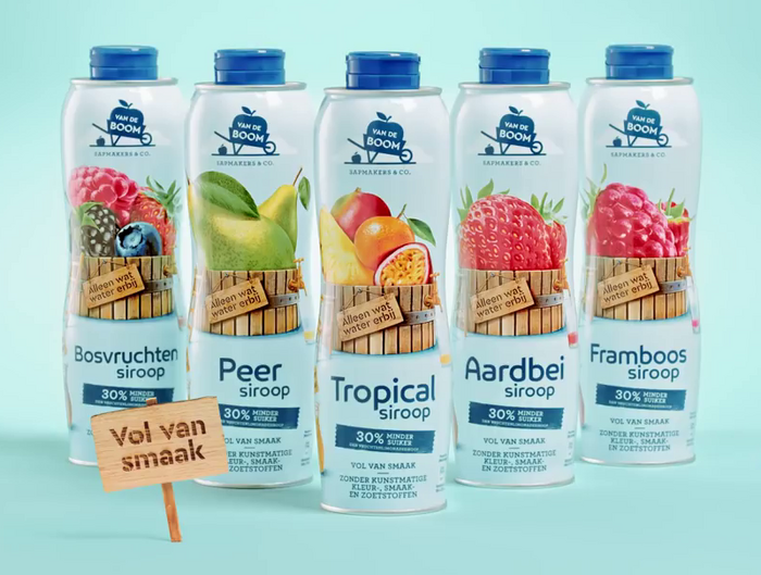 The product names are presented in . Smaller type on the packaging is in ; the wooden sign (“Full of taste”) shows  with a burn effect.