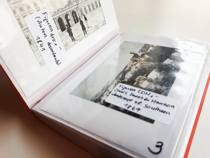 All the photographs are followed by a sticker with a respective label. That is not only important because it gives information about the images (title, author, date), but because it slightly covers them.