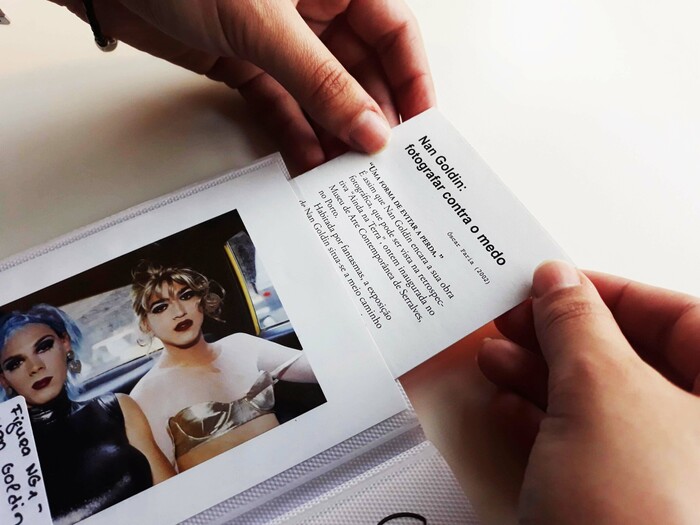 An article about photographer Nan Goldin, hidden by one of her photographs.