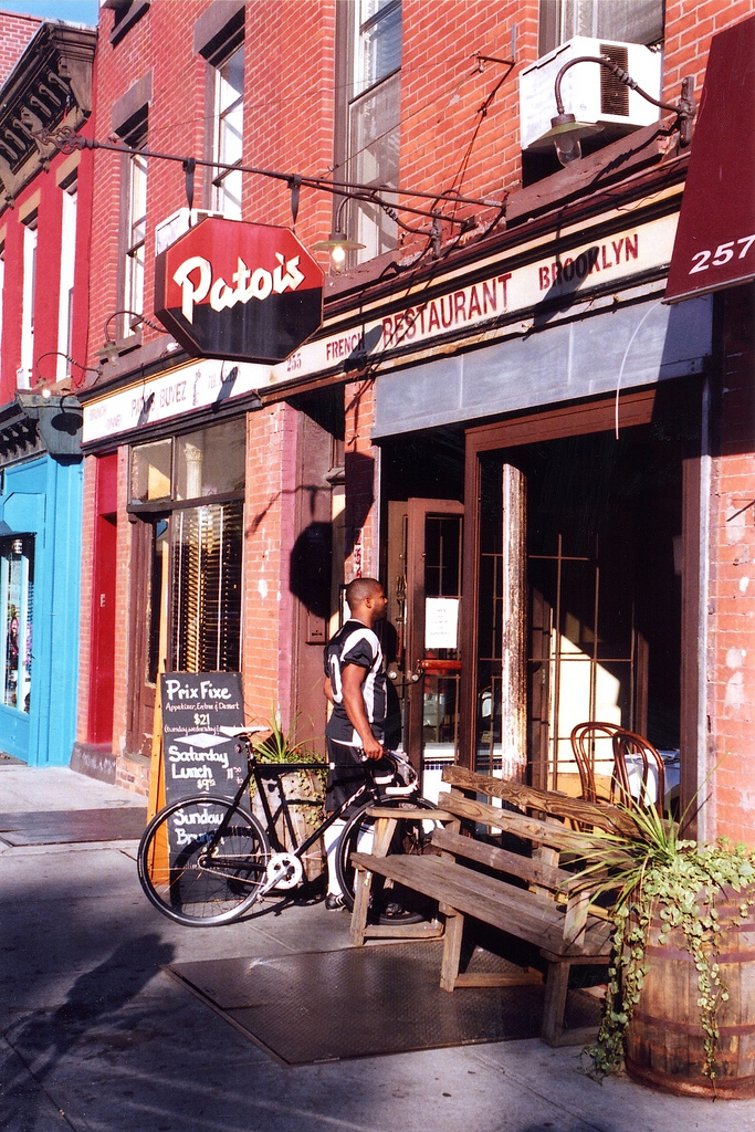 The Patois in the summer of 2008, the last year of the restaurant. The fascia lettering is not by Rosenwald. It includes solid (vinyl?) and stencilled caps from Helvetica and Franklin Gothic.