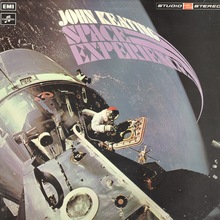 <cite>Space Experience</cite> – John Keating