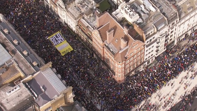 A large 'Put It To The People' banner was carried by the crowd.