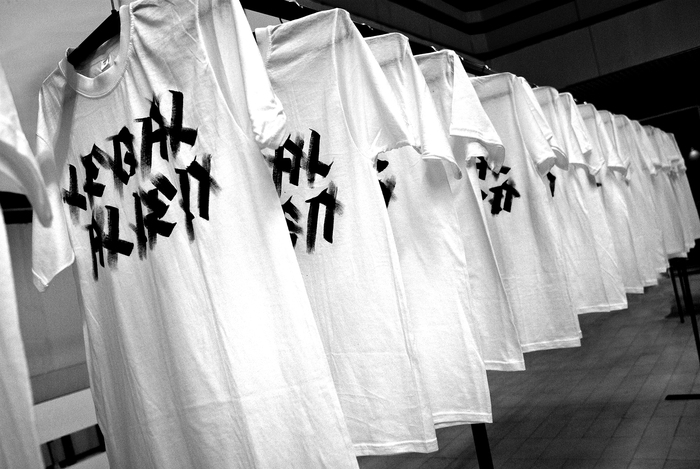 Nada Prlja — Strike, Installation, 2008. Industrial shirt railing, 10m, 100 hand painted T-shirts, 100 hangers. Image from the solo exhibition at the Museum of Contemporary Art, Skopje, Macedonia. Courtesy the artist