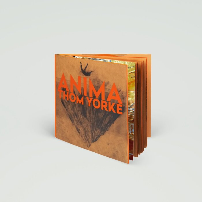 “A beautiful hardback book containing both the lyrics and many strange drawings done in pencil by Stanley Donwood &amp; Dr Tchock. Orange 180 gram double vinyl with an additional 10th track (Ladies &amp; Gentlemen, Thank You For Coming). […] Printed onto Italian Fedrigoni special brown material paper and section sewn, the book is made up with an exposed orange cloth spine and orange gilt edging and finished with bodonian binding.”
