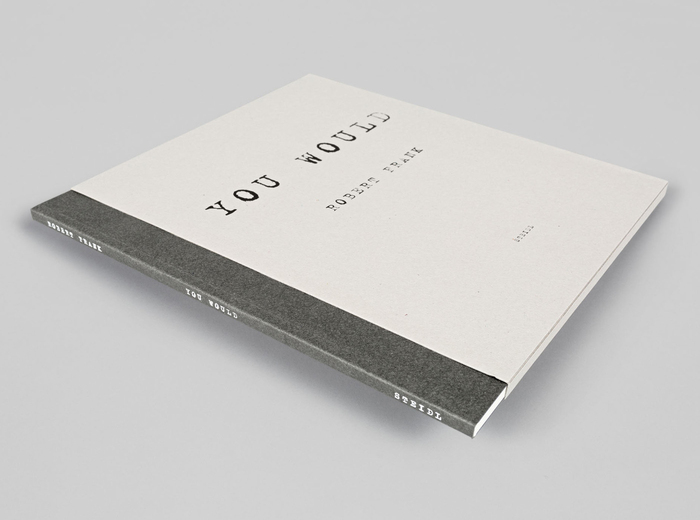 The slipcase shows a reversed, positive version of the cover design.