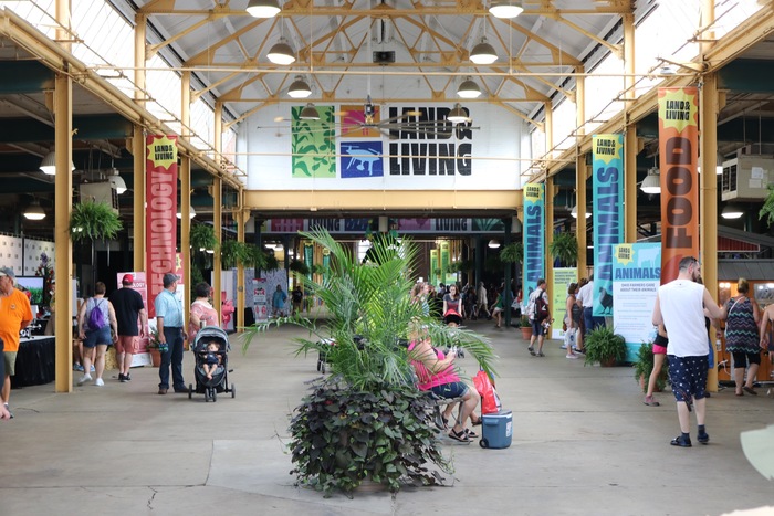 Building interior showing pole banners and logo mural.