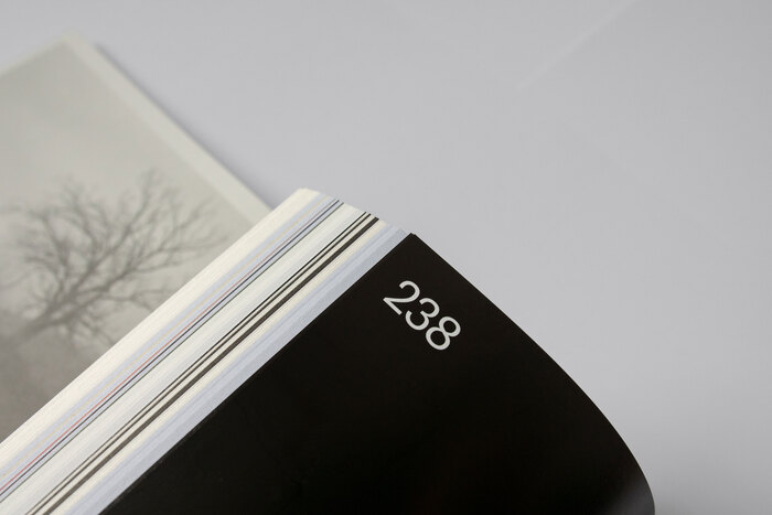 Folio set in GT America. Printed on glossy paper.