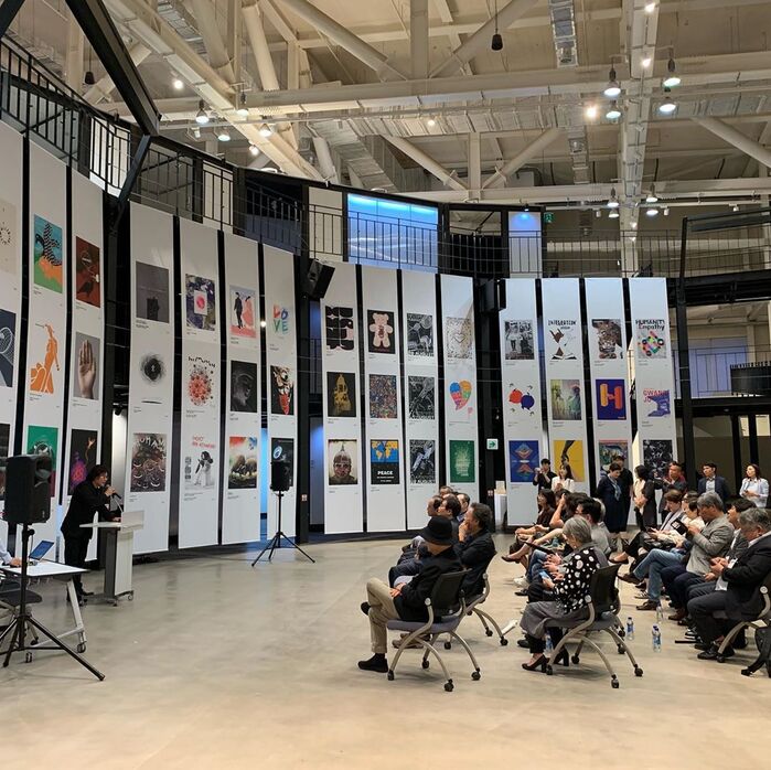 Together, all posters form a backdrop at the biennial. My posters can be seen at the sixth banner from the right.