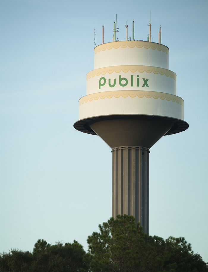Publix facilities in Lakeland, FL feature a water tower with a birthday cake top. You can see it at 3223 New Tampa Hwy, Lakeland, FL.